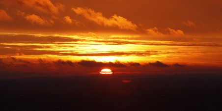 Solopgang over Bugten